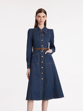 a lady in single-breasted lapel midi denim dress with belt